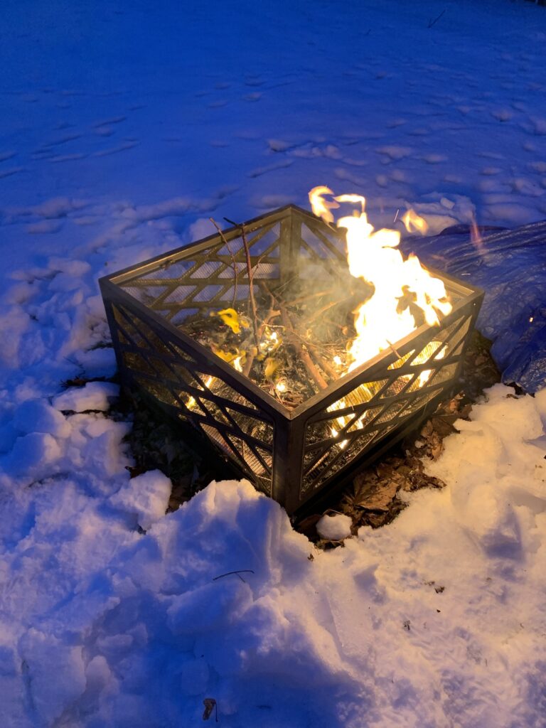 A fire in a backyard fire pit